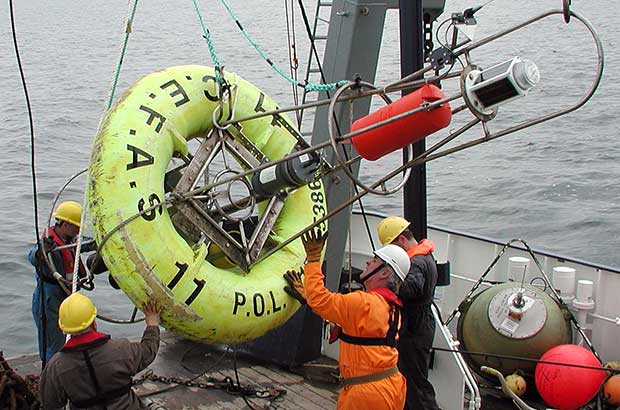 Scientists deploying SMART buoy