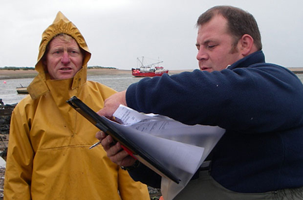 A Fish Health Inspectorate undertaking a compliance inspection on a shellfish farm.
