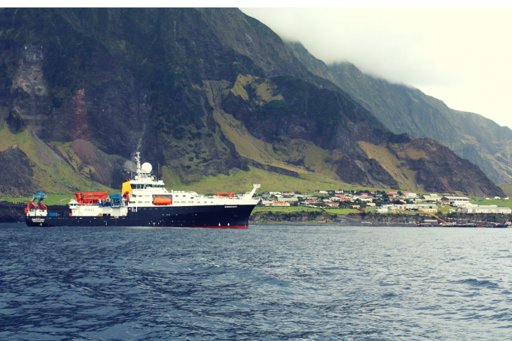the RRS Discovery ship in front of the island Tristan da Cunha