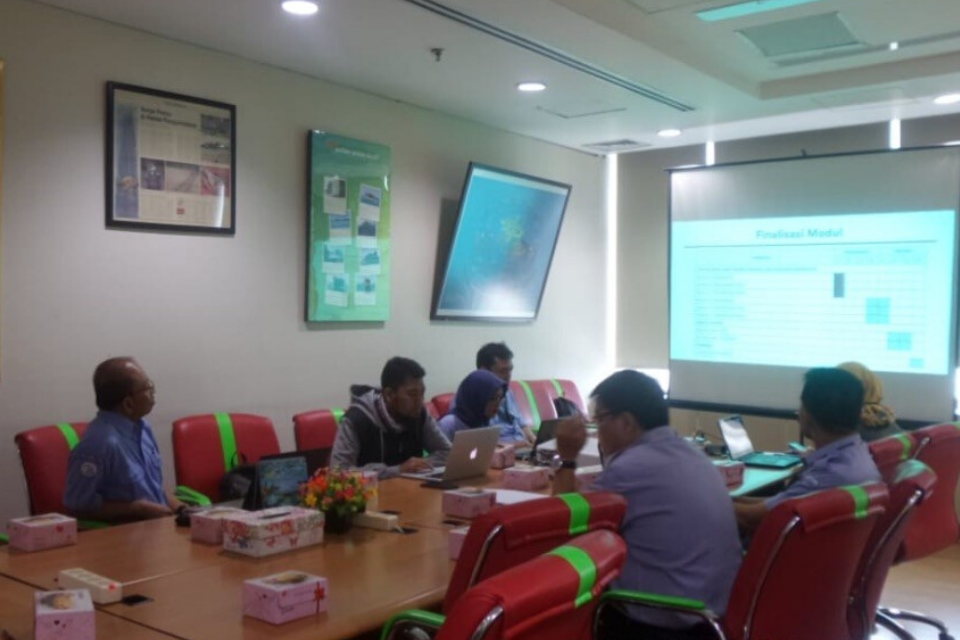 a group of researchers meeting around a table