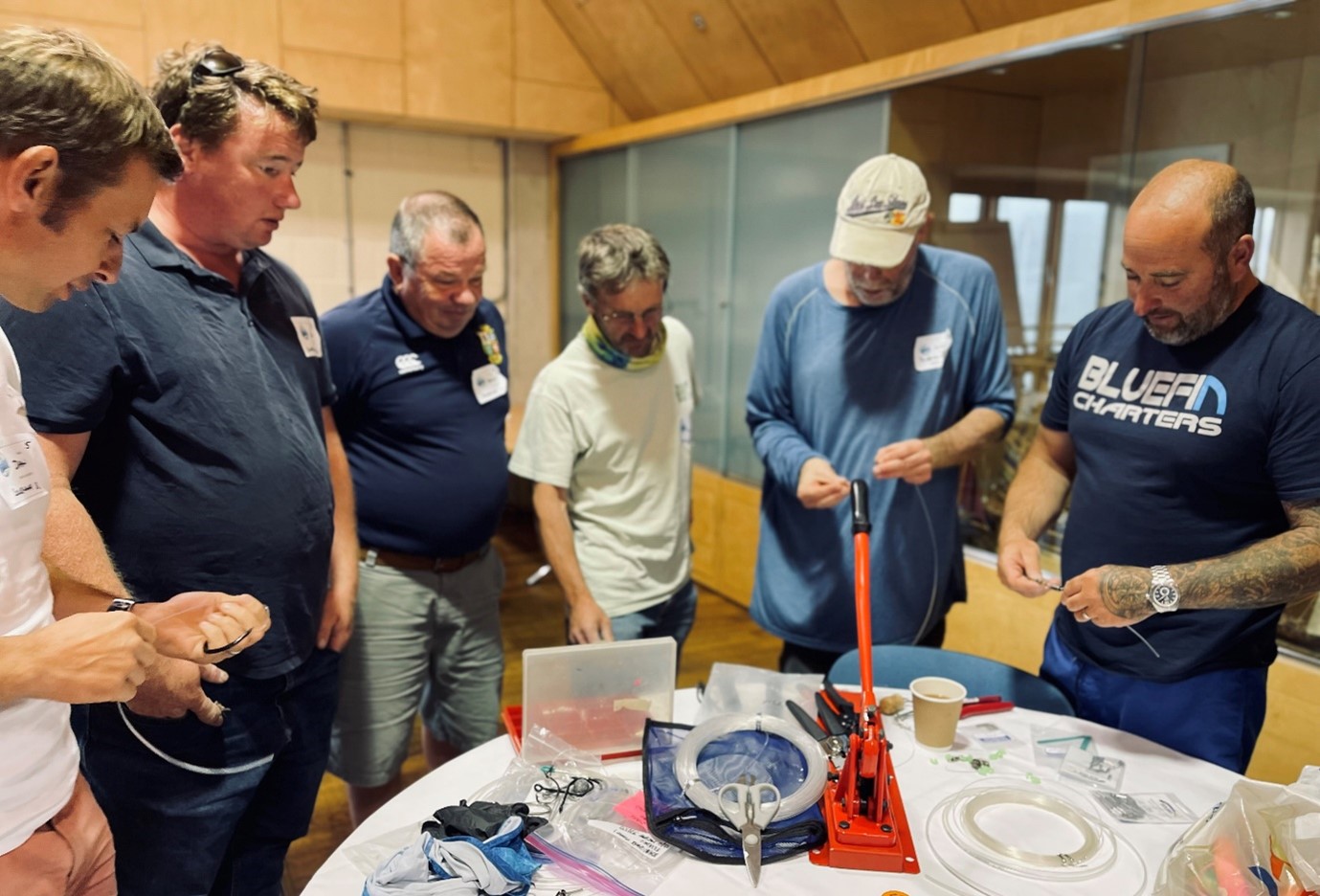 Chart training, people standing round table