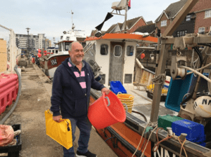 man holding fishing gear