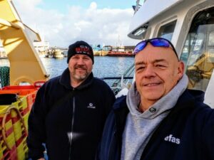 Two men on a fishign boat