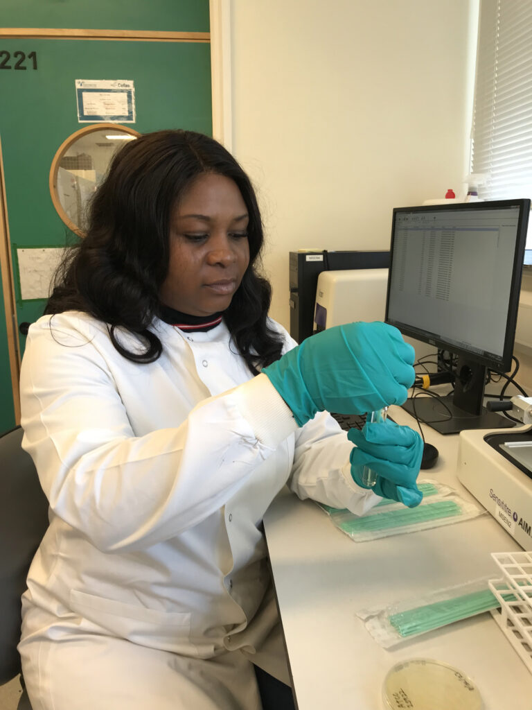 scientist in laboratory studying AMR