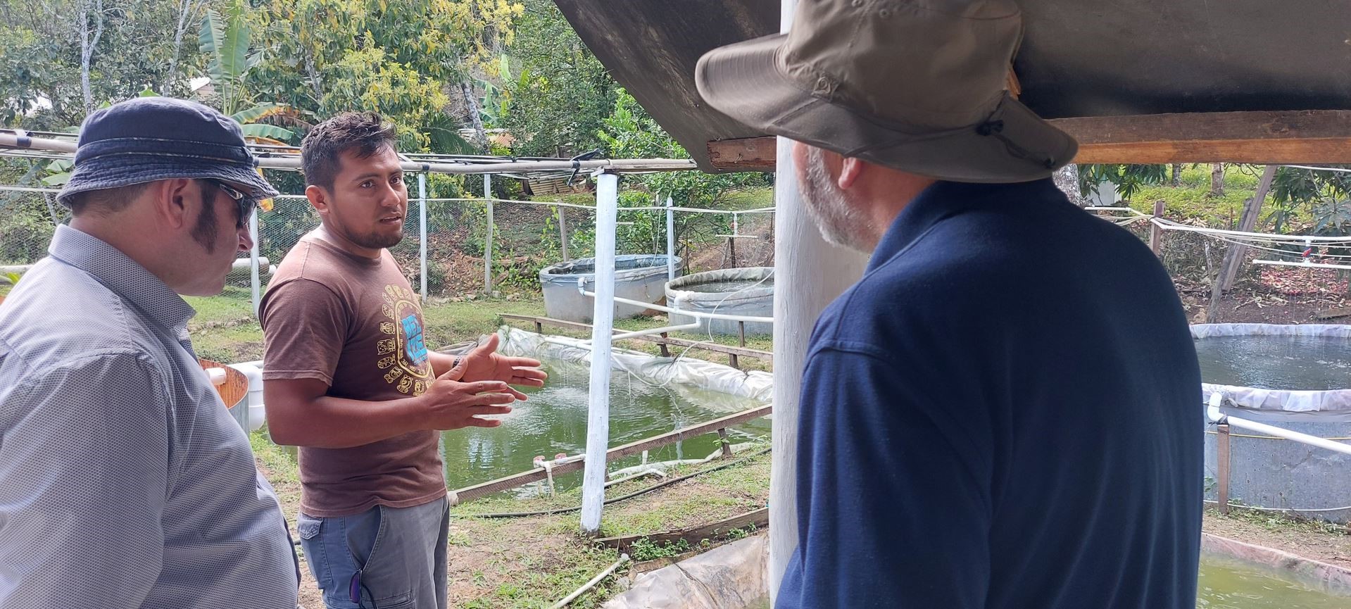 People discussing aquaculture at the hatchery