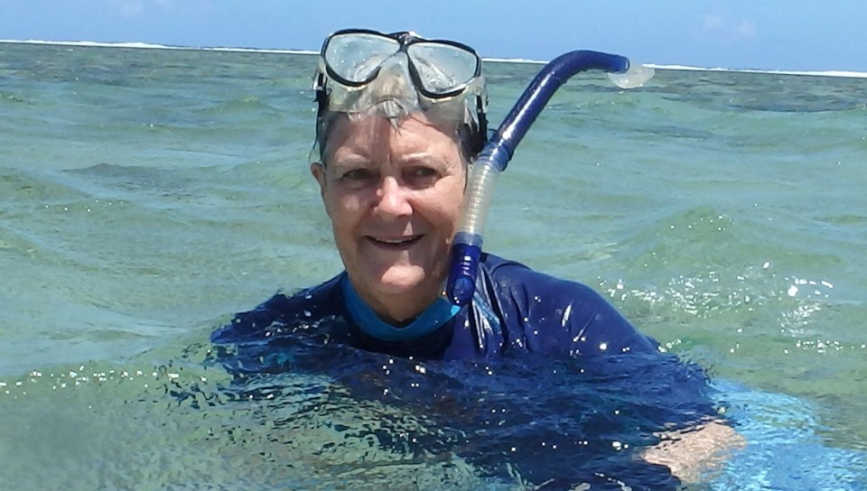 female scientist swimming in the sea