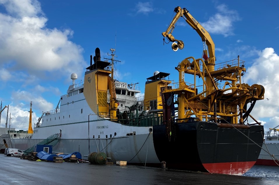 A large fishing vessel at a dock