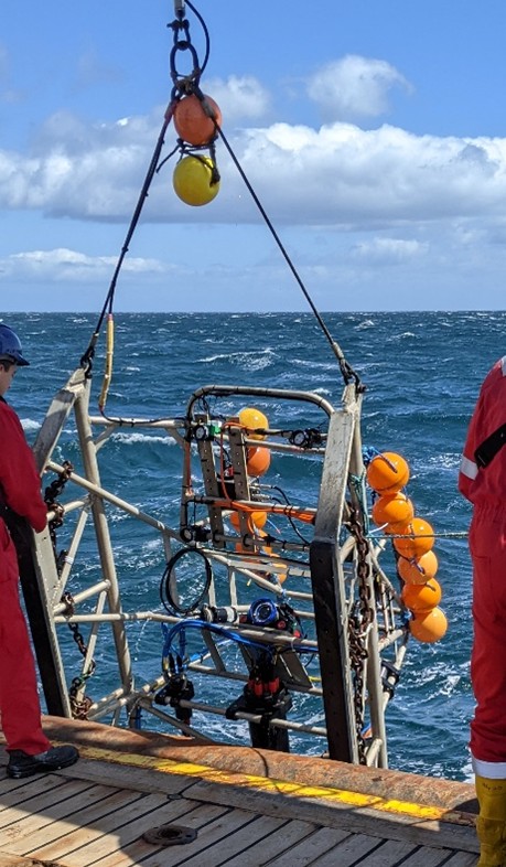 the survey sledge being lowered from the ship into the sea