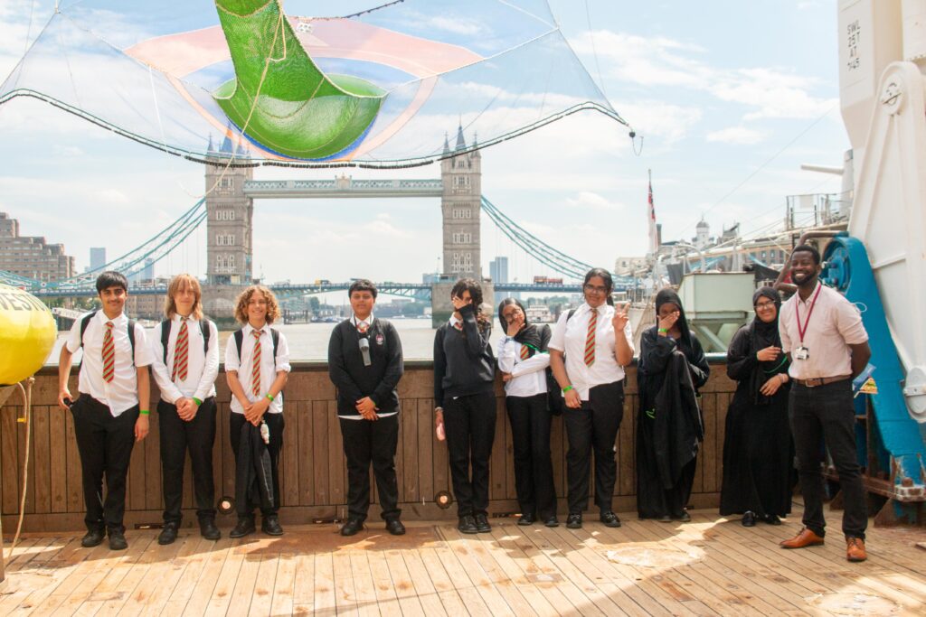 A group of students stood on the back deck of the RV Cefas Endeavour